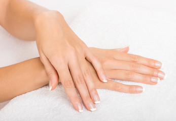 Obraz na płótnie Canvas Hands on towel - Manicure