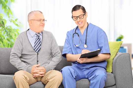 Male doctor talking to a senior patient