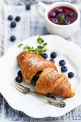 Breakfast, croissant with blueberries