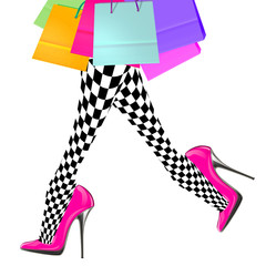 woman legs with pink high heel shoes and shopping bags