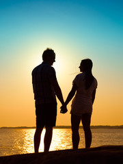 Young couple and sunset