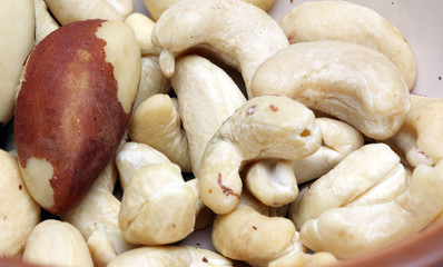 variety of tasty nuts in a brown bowl