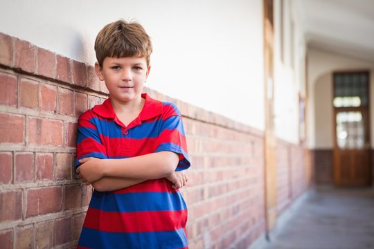 Cute pupils looking through magnifying glass