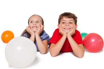 Fototapeta na wymiar Happy little children smiling with balloons