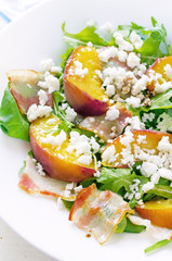 salad with peaches, bacon; arugula, spinach and goat cheese