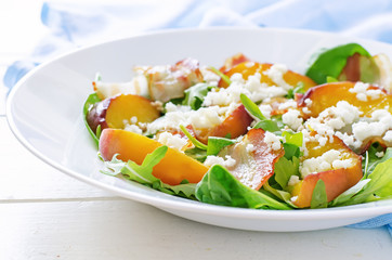 salad with peaches, bacon; arugula, spinach and goat cheese