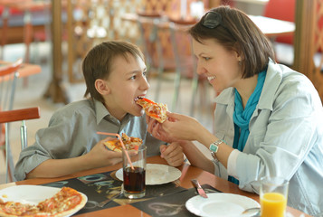 Mother feeding her son
