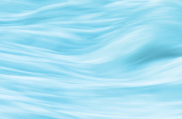 Background - sanfte Wasserwellen hellblau
