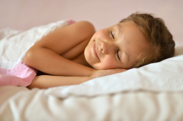 Obraz na płótnie Canvas Cute girl sleeping in bed