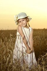 Little girl in the wheat field