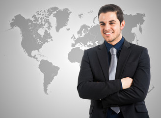 Businessman in front of a world map