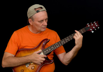 Obraz premium Portrait of amateur musician playing guitar