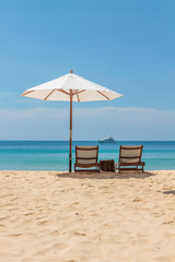 Sunbeds and umbrella on Freedom beach Koh Phuket