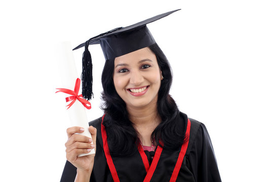 Happy young female student holding diploma