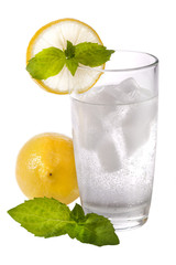 glass of cold sparkling water with lemon and mint