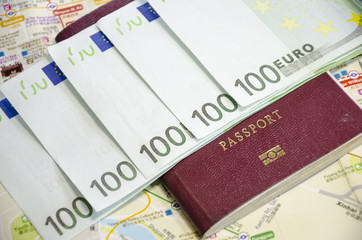 passport with bank notes and map