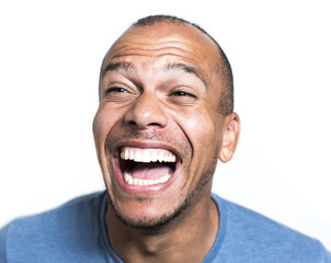 Portrait of a mixed race man laughing hysterically
