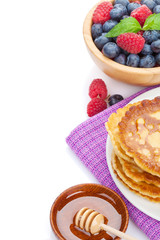 Pancakes with raspberry, blueberry, mint and honey syrup