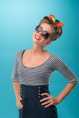 Beautiful girl with pretty smile in pinup style posing