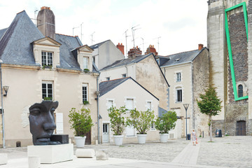 statue on Rue du Musee street in Anges, France