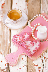 red heart cookies and espresso Coffee cup on old wooden table