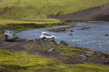Fototapeta na wymiar Jeep overcomes River