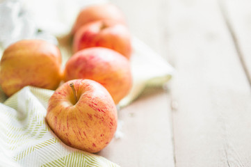 Apples on wooden background