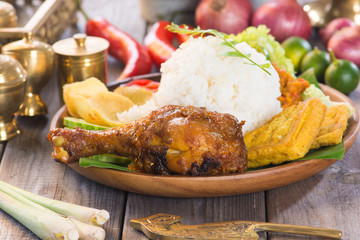 Famous traditional Indonesian food. Delicious nasi ayam penyet w