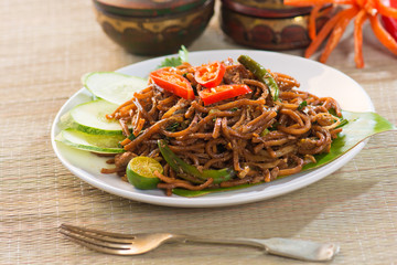 fried noodle with traditioal background
