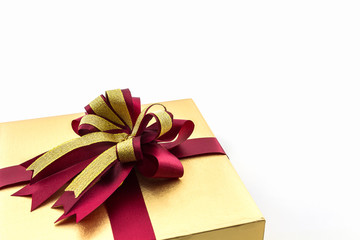 Gold and brown gift box with ribbon bow.