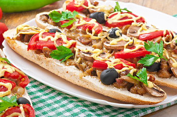 Baguette stuffed with veal and mushrooms with tomatoes 