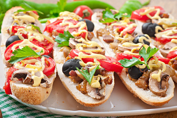 Baguette stuffed with veal and mushrooms with tomatoes 