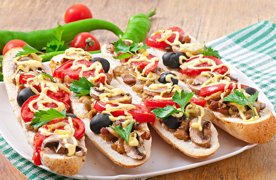 Baguette stuffed with veal and mushrooms with tomatoes 