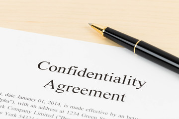 Confidentiality agreement document with pen close-up