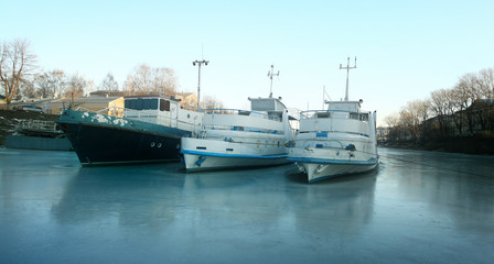 ships on the frozen river, boat parking