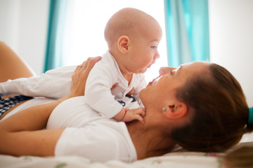 Mother hugging baby