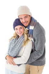 Attractive couple in winter fashion hugging