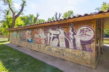 modern brick house full of graffiti vandalism