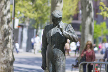bronze sculpture of a bullfighter in a park
