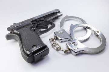 steel gun and handcuffs to stop criminals