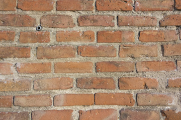 Background of red bricks wall with cement