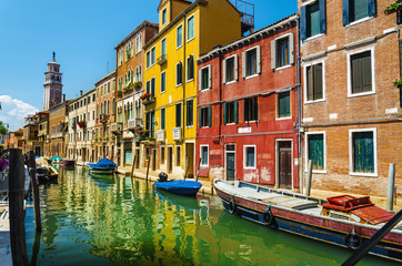 Fototapeta na wymiar Romantic scenery, colorful houses on the canal, Venice, Italy
