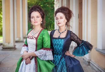 Two beautiful women in medieval dresses