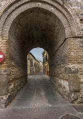 Fototapeta na wymiar Mudejar brick passageway Santa Maria, in Arevalo, Spain