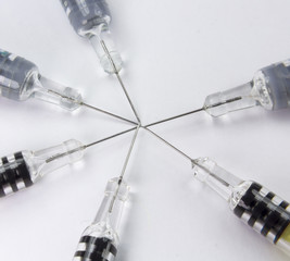 needle and syringe in a star