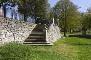 stone staircase in a garden of green boil