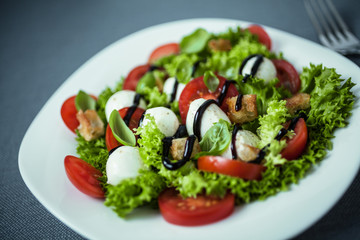 Italian salad with mozzarella pearls