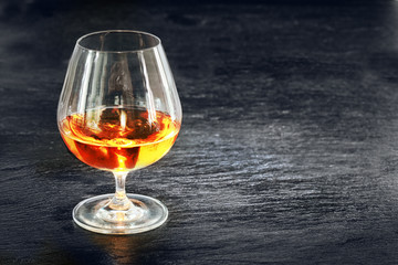 Elegant snifter with glowing golden cognac
