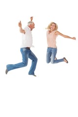 Excited couple cheering and jumping