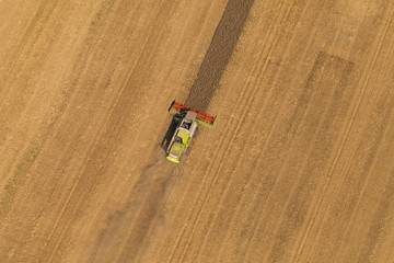 aerial view of combine on harvest field